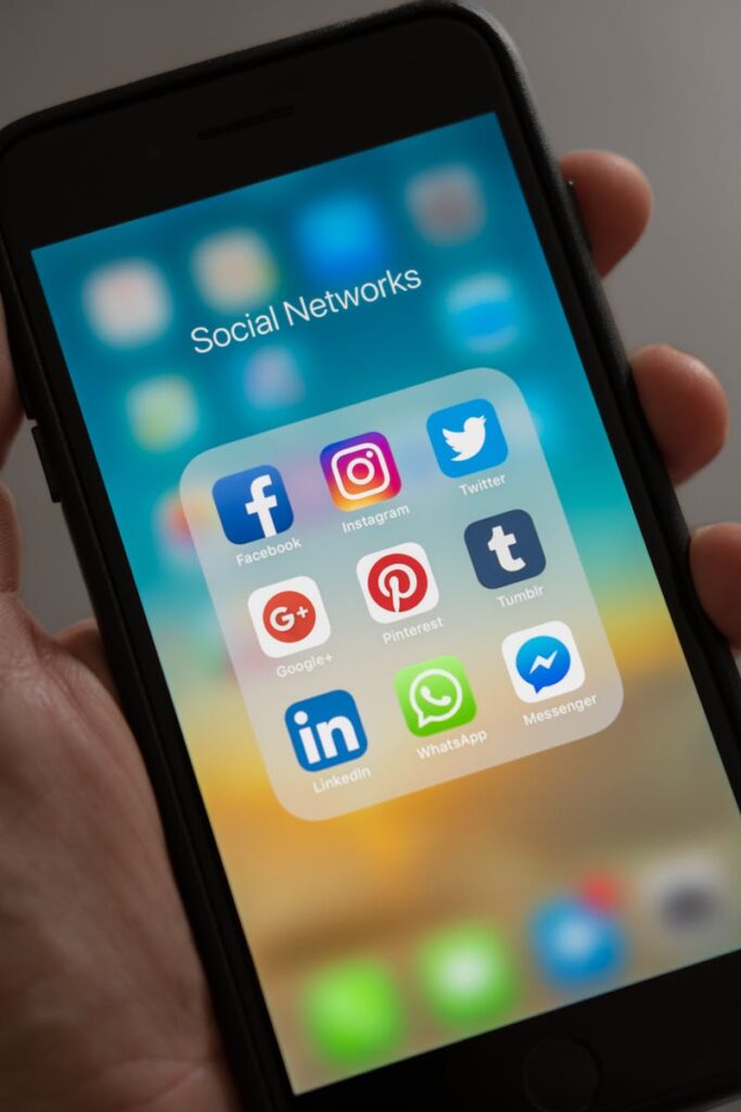 pexels-photo-607812-607812-1 A smartphone displaying various social media icons held in a hand, showcasing modern communication apps.